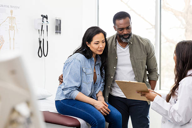 Men's and Women's Health — doctor consulting a couple